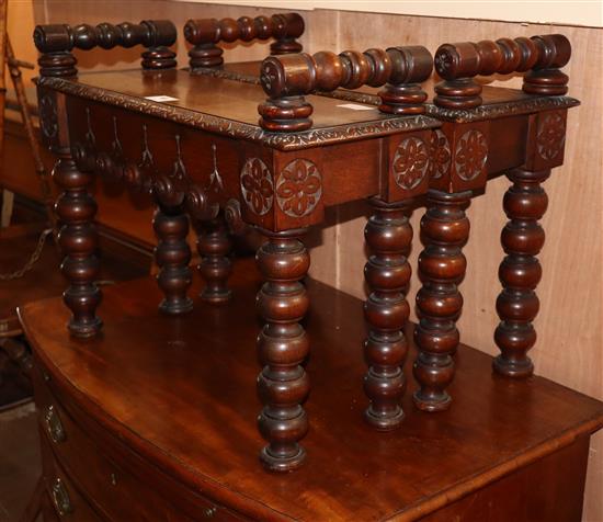 A pair of small late Victorian carved oak hall benches, W.65cm D.25cm H.43cm